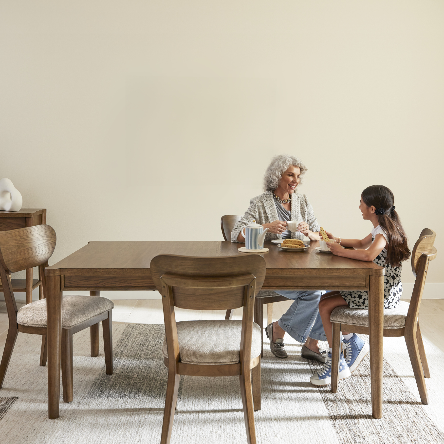 family sitting at a dining room table