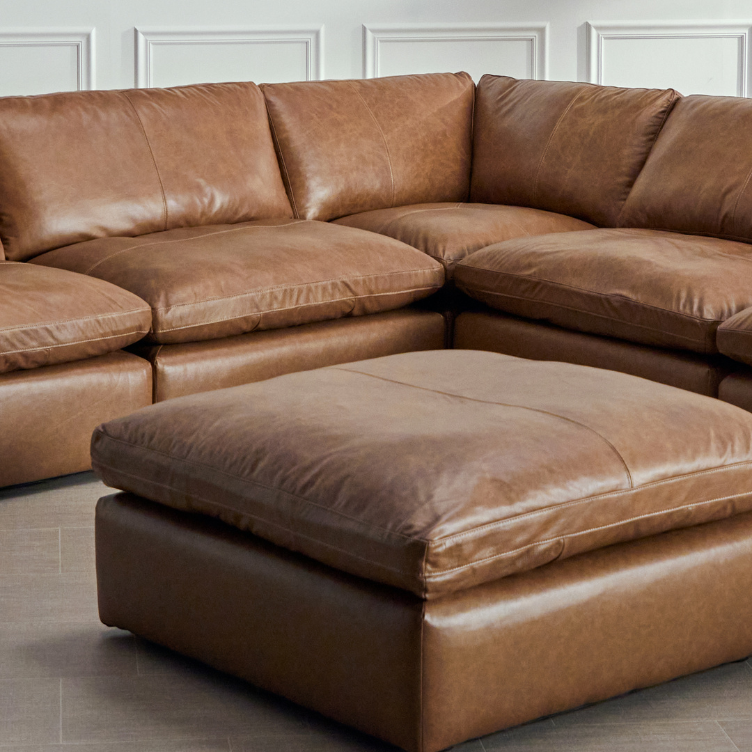 brown leather sectional with ottoman