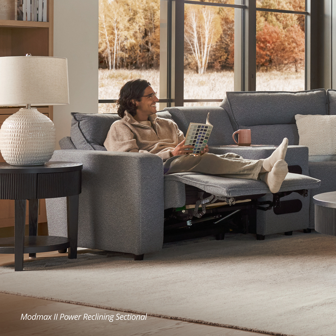 man sitting on modmax power reclining sofa