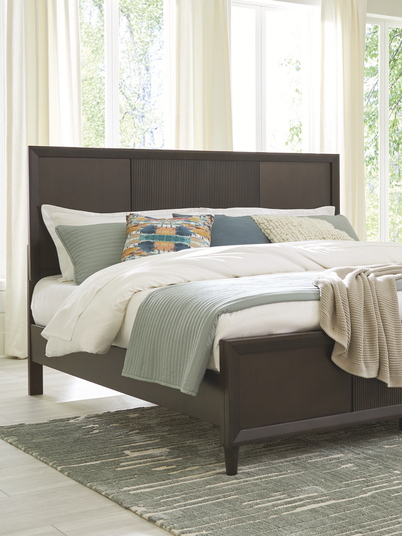 white and green bedding on a bed