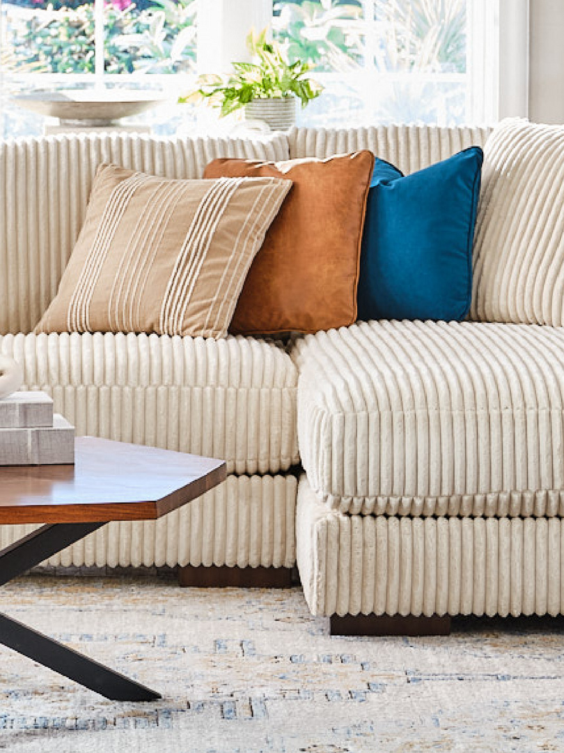 white couch with colorful pillows