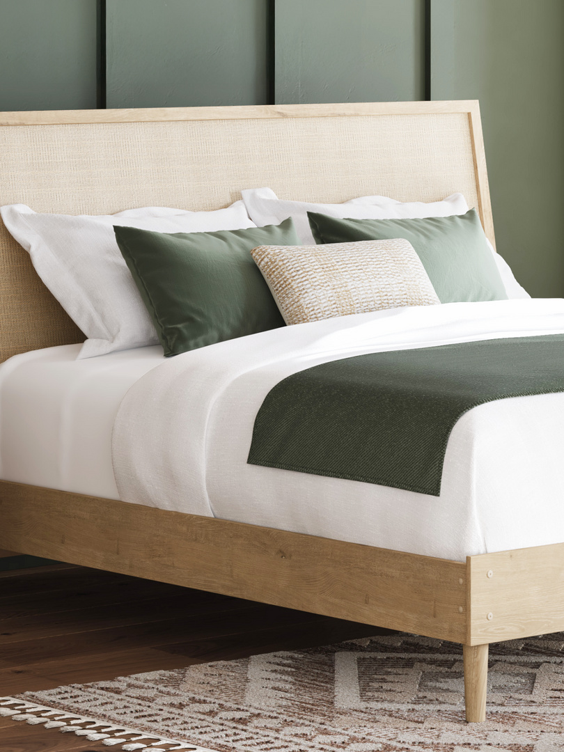 white and green bed sheets on a bed