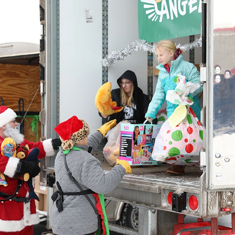 handing out toys from truck