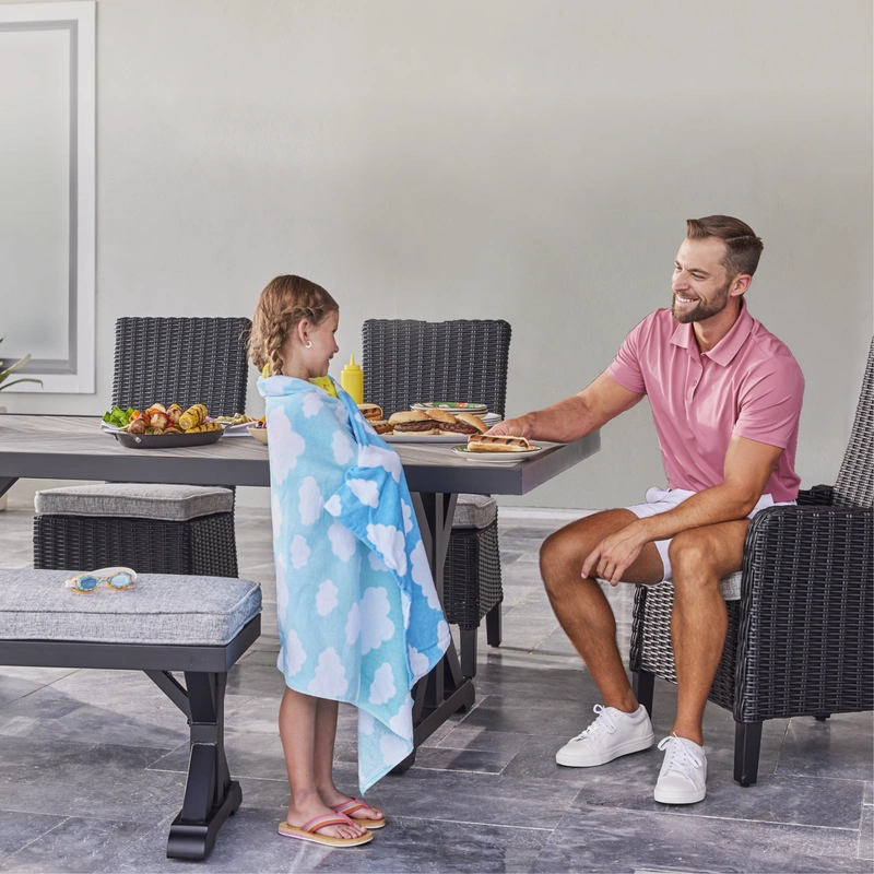 Father and Daughter sitting at outdoor table