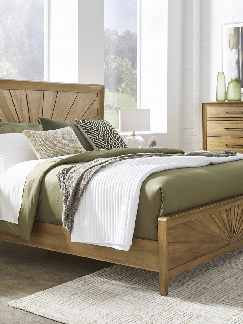 wood bed with green bedding