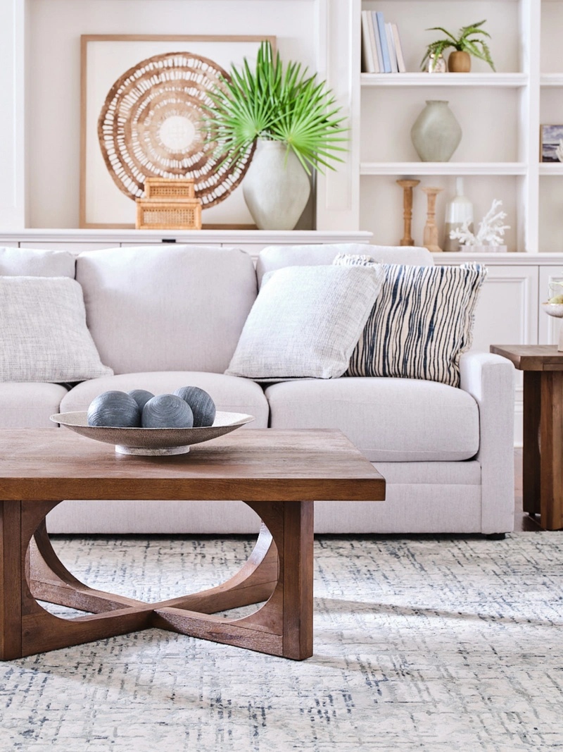 white sofa and wood coffee table