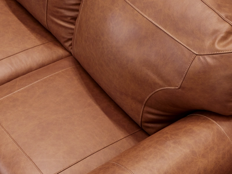 close-up image of a brown leather sofa