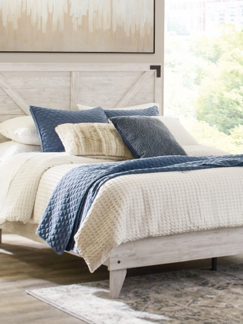 Light wood bed frame and bedding