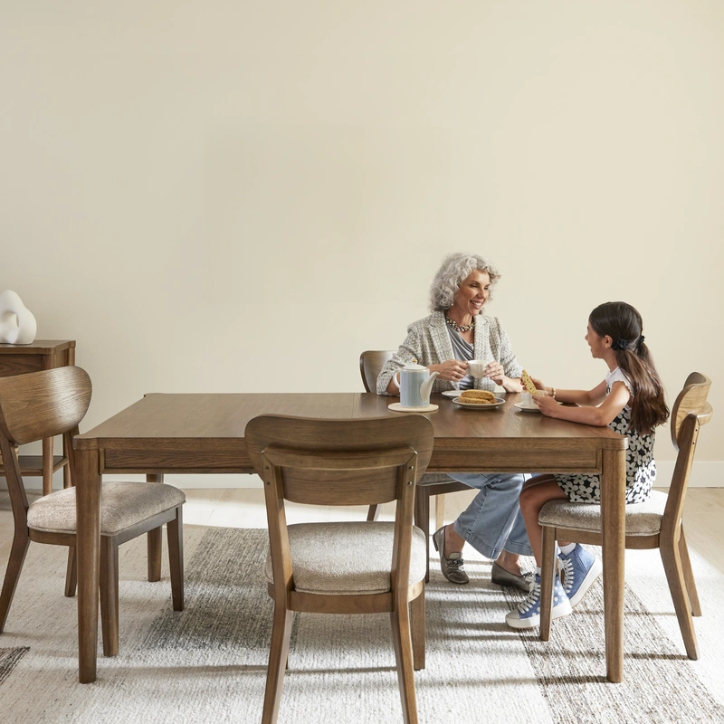 family sitting at a dining room table