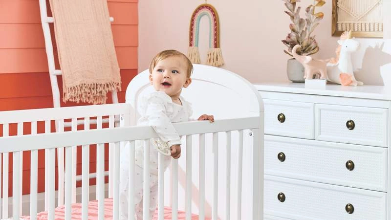 white baby in crib