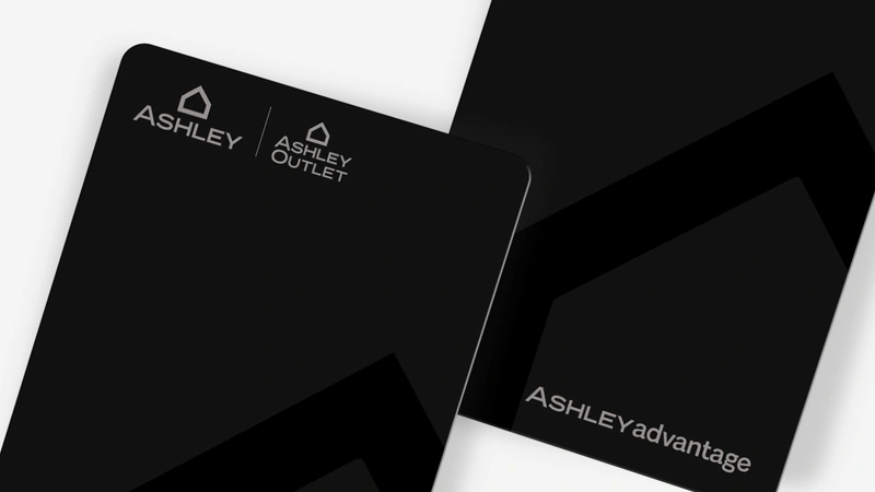 Two ashley credit cards on grey background