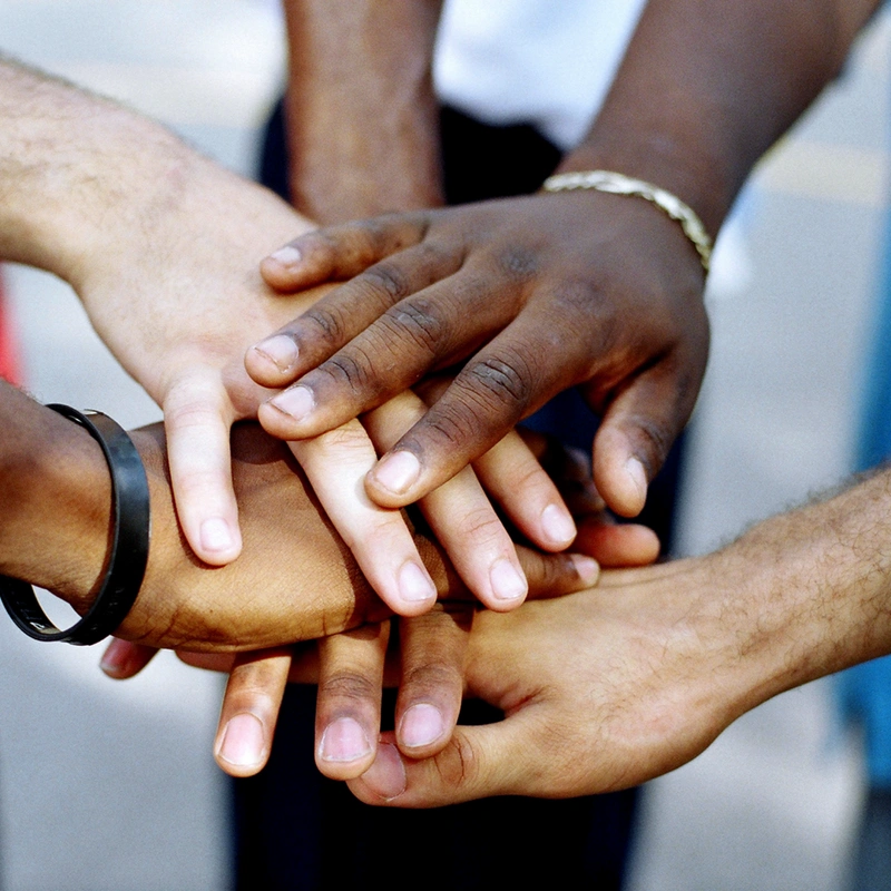 four hands on top of each other