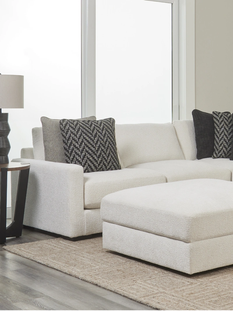 gray sectional and pillows