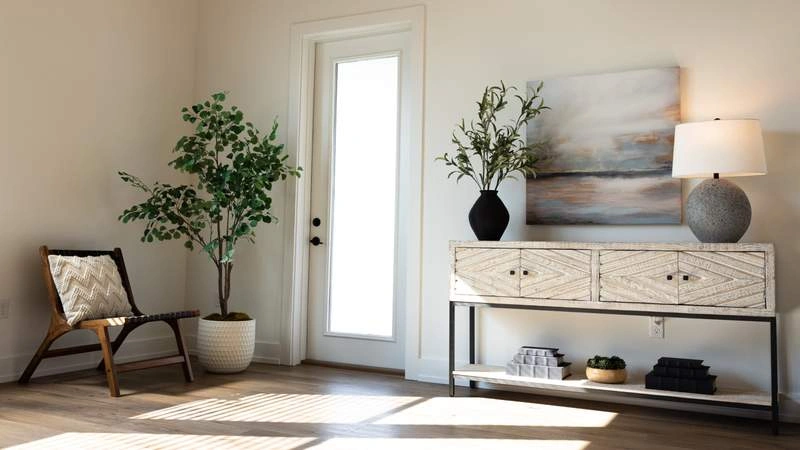 Sun bathed room with chair and beige furniture
