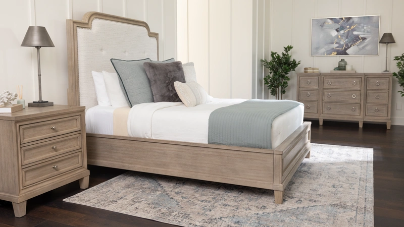 tan bedroom set with bed, nightstand, and dresser
